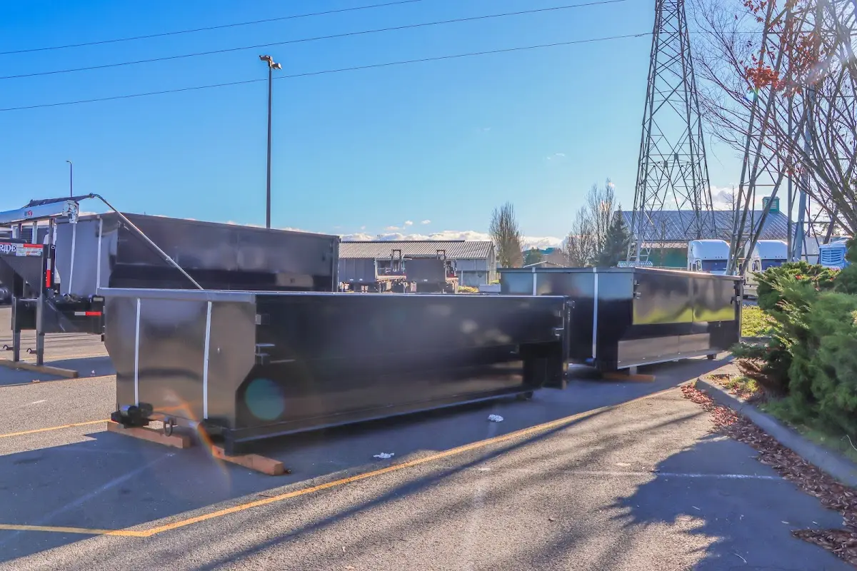Roll-off dumpster ready for waste disposal at job site for Demolition Dumpster Rental in Essex